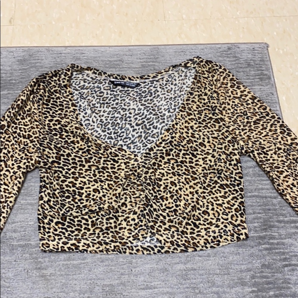 cheetah crop top with cinch in center. NWOT